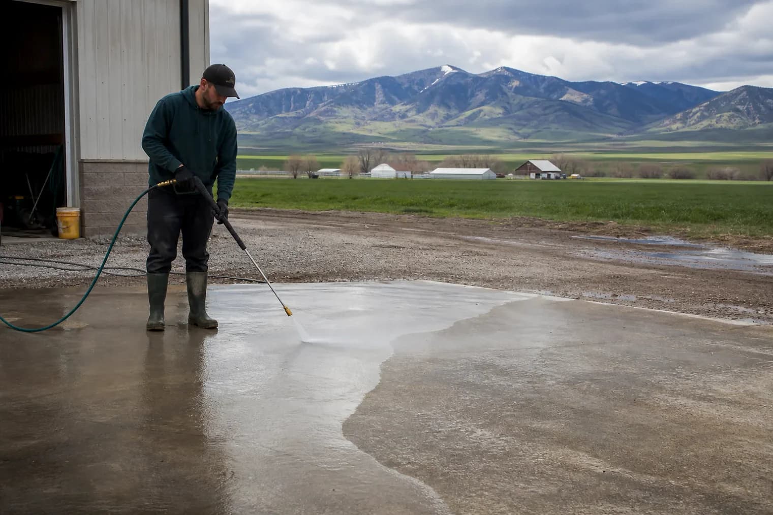 Exterior-cleaning scene inspired by Bear River City, Utah, with characteristic Cache Valley and far northern Utah landscape