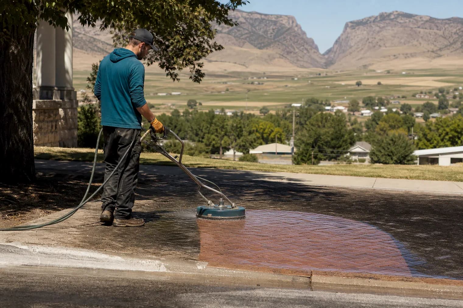 Exterior-cleaning scene inspired by Elsinore, Utah, with characteristic central Utah landscape