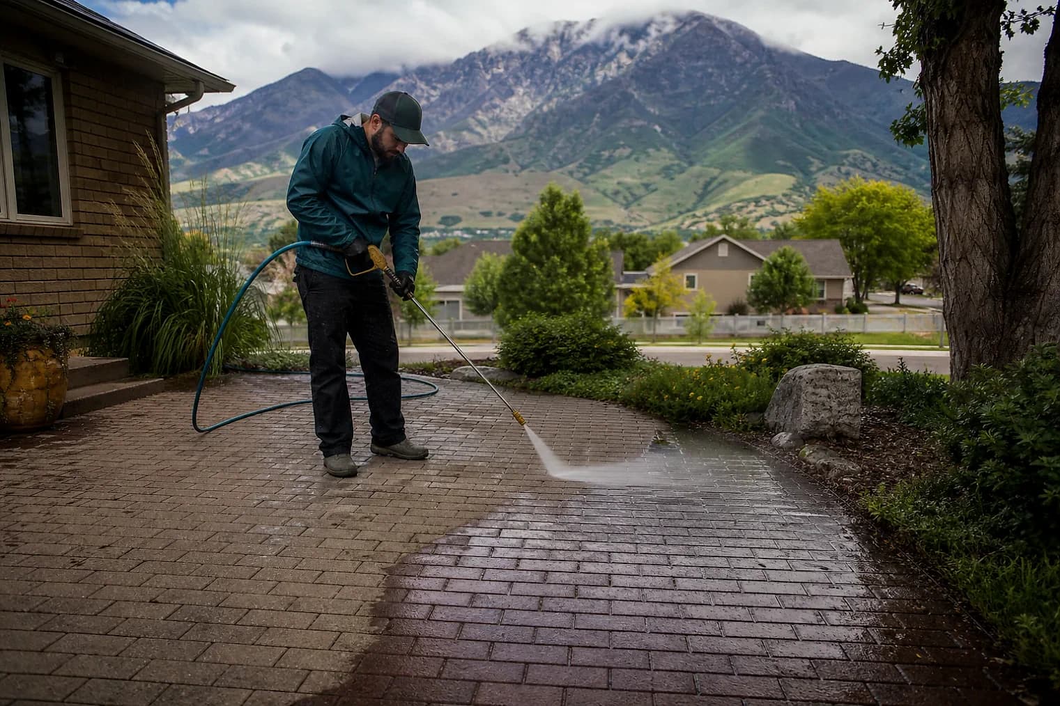 Exterior-cleaning scene inspired by Syracuse, Utah, with characteristic the Wasatch Front landscape